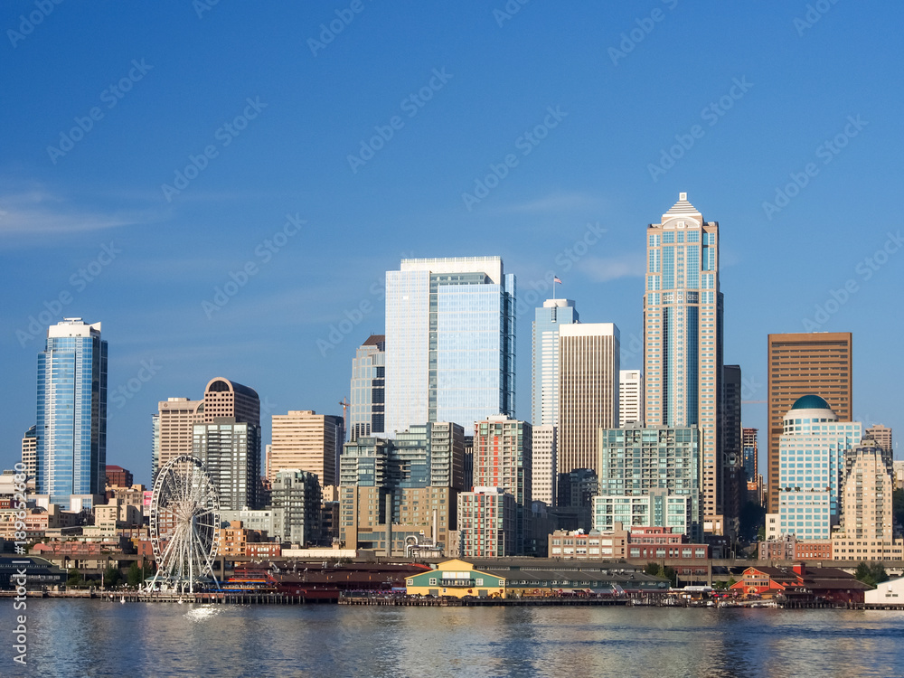 Seattle Washington skyline view from the bay during a clear day with blue skies.