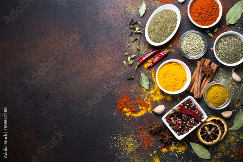 Fototapeta Naklejka Na Ścianę i Meble -  Set of Various spices on dark stone table.