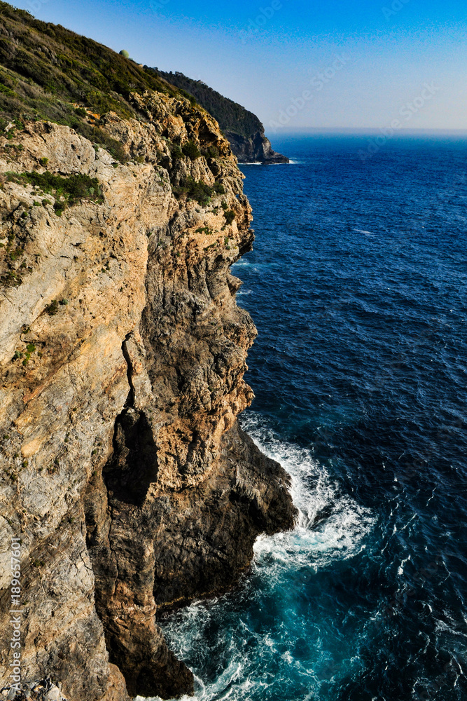 Seaside cliffs on blue ocean