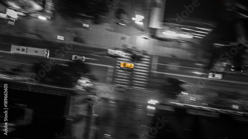 Wallpaper Mural Drone view of a car in focus and blurred background. aerial blur motion Torontodigital.ca