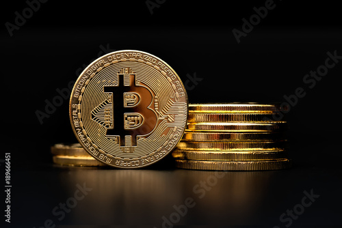 crypto currency bitcoin golden representation on black background