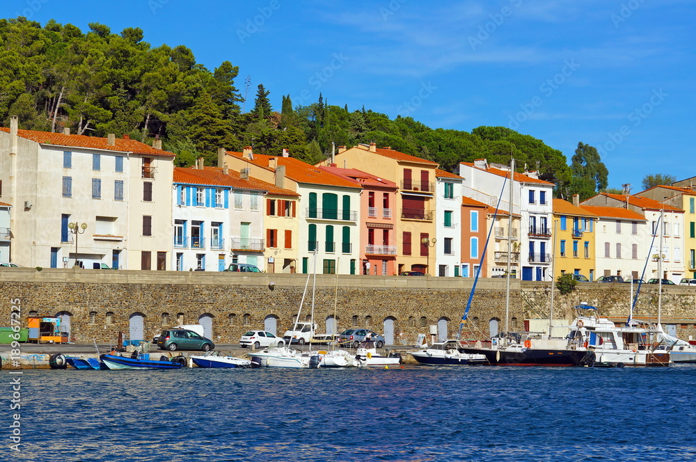 Colorful seafront houses with boats in the Mediterranean harbor of Port-Vendres, Roussillon, Pyrenees Orientales, France