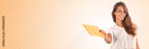 Pretty woman holding a blank envelope, isolated on white, customizable background