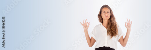 Beautiful business lady meditating; copy space horizontal size photo.