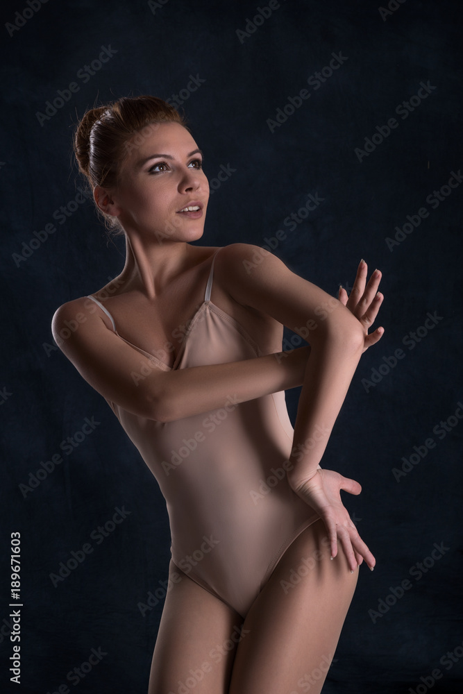 Fototapeta premium the ballerina dances on a dark background