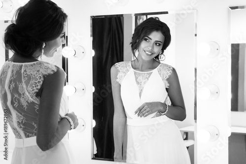 Portrait of a beautiful female model in a light dress