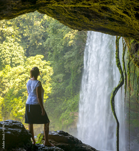 Tourist In Cave At Misol Ha Waterfall photo