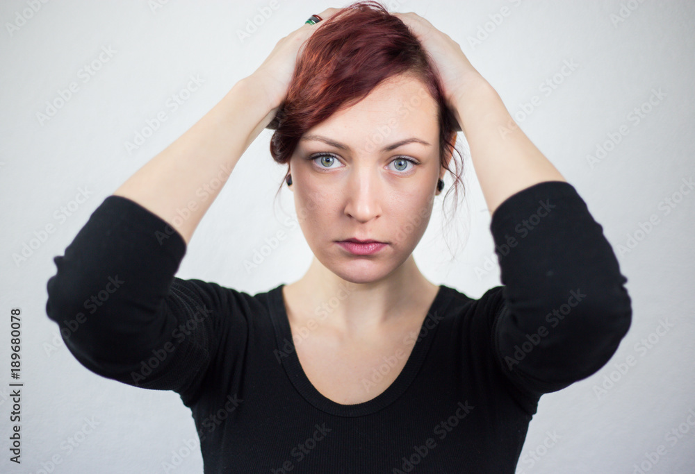 Young girl with a surprised expression on a white background, studio Young girl with a surprised expression on a white background, studio