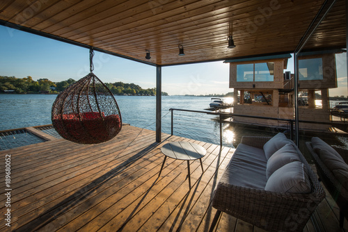 Sofa and hammock on terrace of raft cottage photo