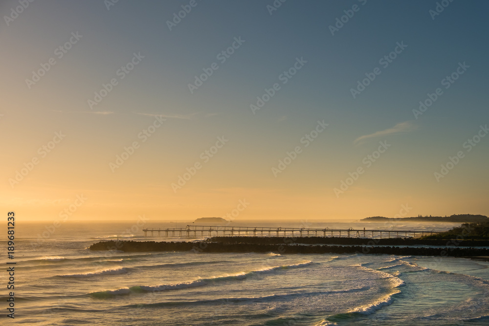 Gold Coast, Queensland/Australia - 19 January 2018: Morning views from Point Danger over the rock wall and sand pumping jetty on the Southern Gold Coast, Australia. Gold Coast, Queensland/Australia - 19 January 2018: Morning views from Point Danger over the rock wall and sand pumping jetty on the Southern Gold Coast, Australia.