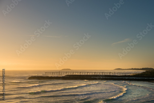 Gold Coast  Queensland Australia - 19 January 2018   Morning views from Point Danger over the rock wall and sand pumping jetty on the Southern Gold Coast  Australia.