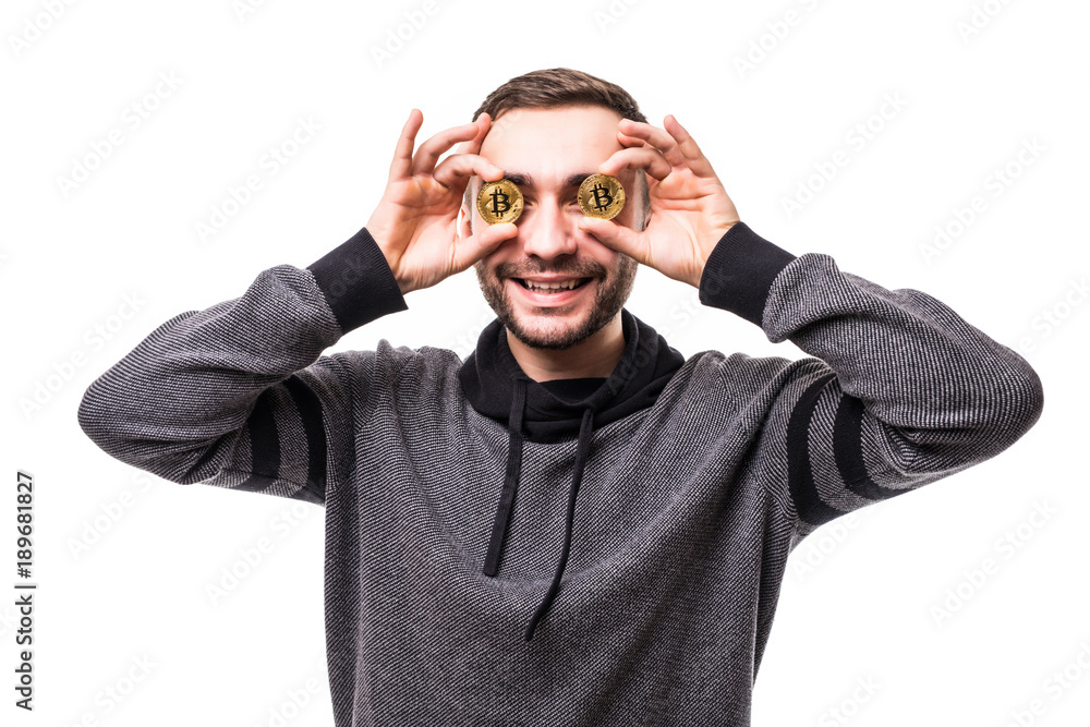 Close up of man with bitcoins in his eyes pointing fingers isolated over white background Close up of man with bitcoins in his eyes pointing fingers isolated over white background