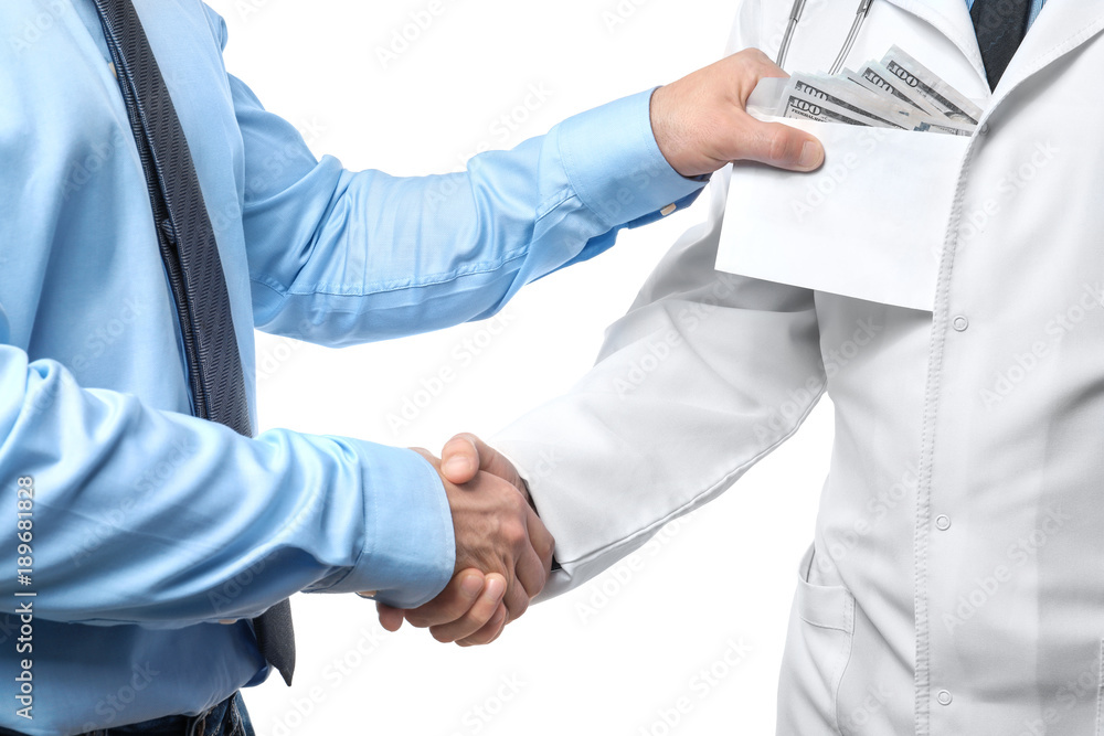 Doctor getting money in envelope from man on white background. Corruption concept