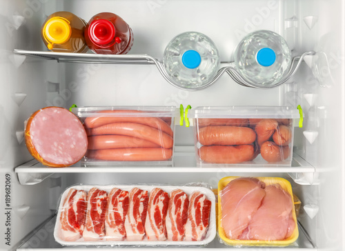 Refrigerator with fresh meat products, closeup
