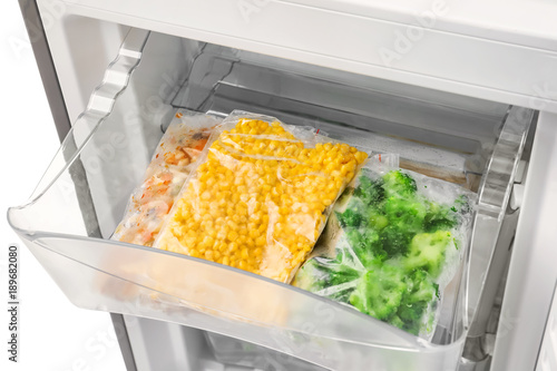 Frozen vegetables in refrigerator, closeup
