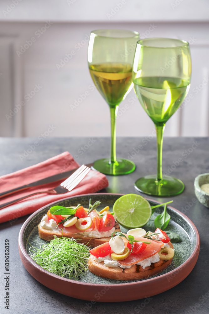 Tasty bruschettas with prosciutto, tomatoes and mozzarella on plate Tasty bruschettas with prosciutto, tomatoes and mozzarella on plate
