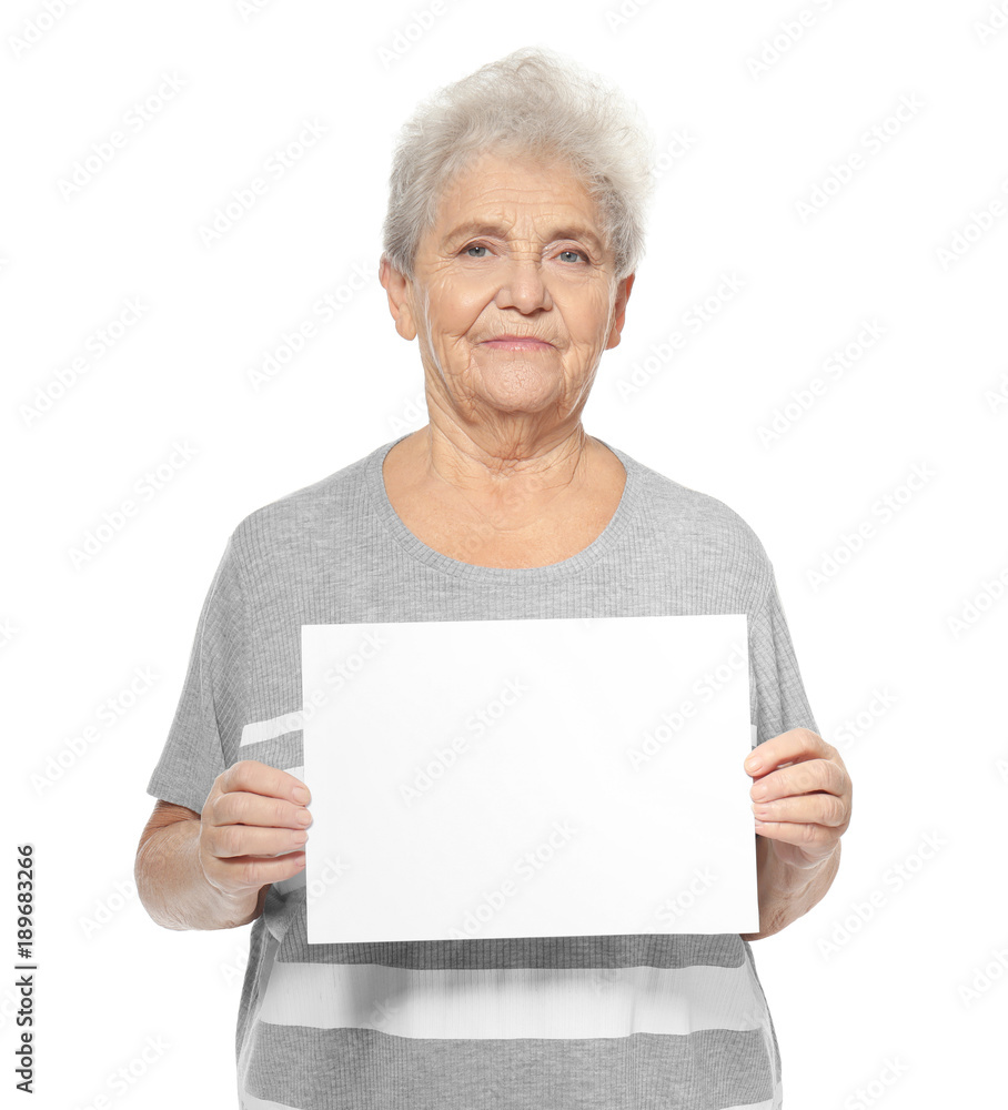 Senior woman with blank sheet of paper for advertising on white background Senior woman with blank sheet of paper for advertising on white background