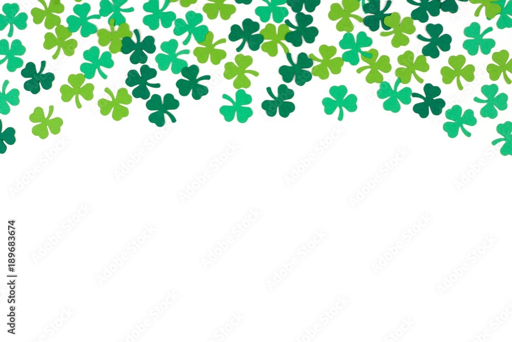 St Patricks Day top border of paper shamrocks over a white background St Patricks Day top border of paper shamrocks over a white background
