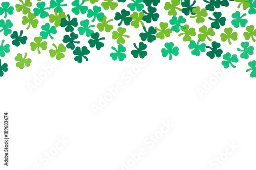St Patricks Day top border of paper shamrocks over a white background