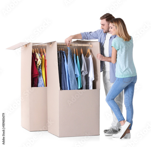 Young couple near wardrobe ...
