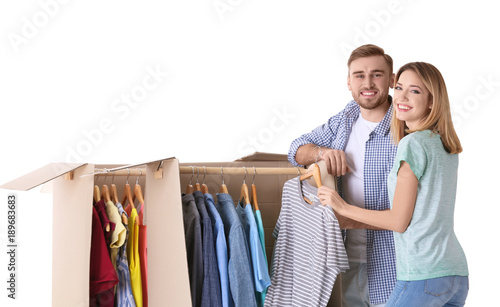 Young couple near wardrobe ...