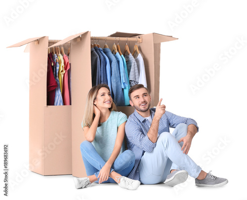 Young couple near wardrobe ...