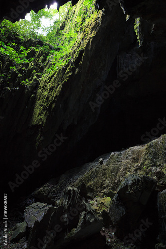 Cave opening to lush forest Gunung Mulu national park Borneo Malaysia