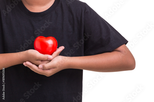 Love heart and healthcare concept : Woman holding red heart on her chest and heart position isolated on white