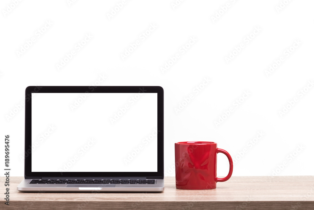 Modern laptop computer on wooden table. Studio shot isolated on white. Blank screen for graphics display montage Modern laptop computer on wooden table. Studio shot isolated on white. Blank screen for graphics display montage