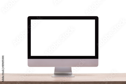 Modern desktop computer on wooden table. Studio shot isolated on white. Blank screen for graphics display montage