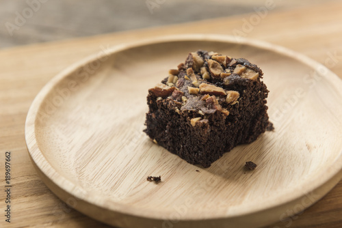 Chocolate brownie dessert on wooden background close up