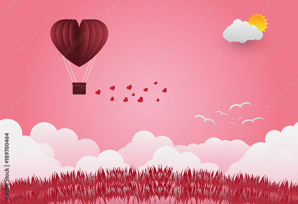 Valentine's day balloons in a heart shaped flying over grass view background, paper art style.