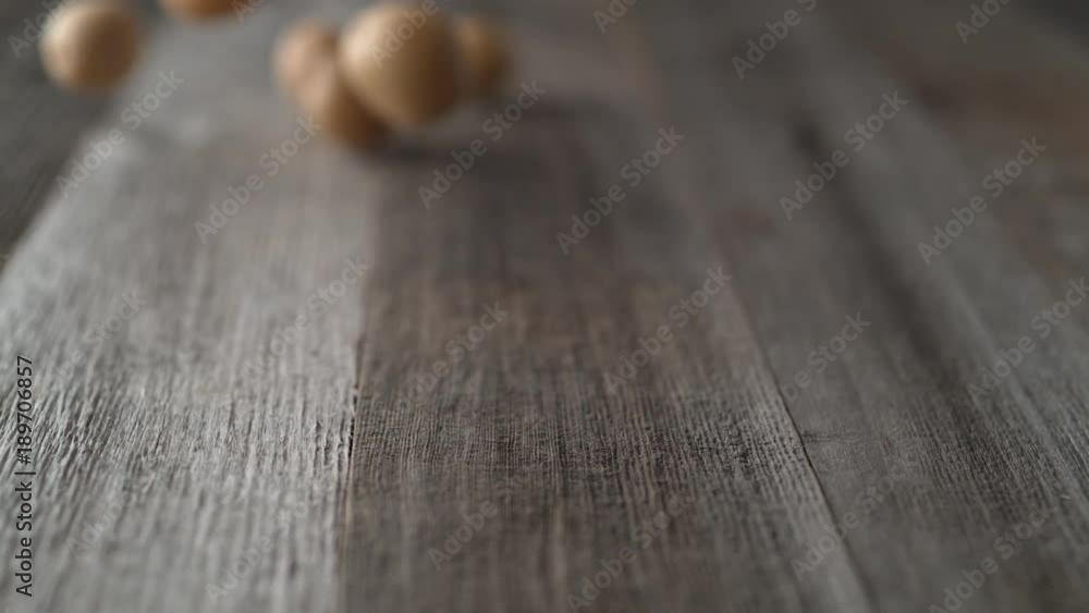 Potatoes falling and rolling on a table. Shot with high speed camera, phantom flex 4K. Slow Motion. Potatoes falling and rolling on a table. Shot with high speed camera, phantom flex 4K. Slow Motion.