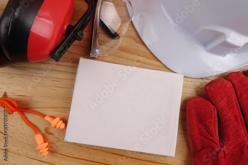 HEALTH AND SAFETY CONCEPT. Personal protective equipment on wooden table background. Copy space photo