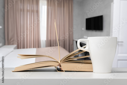 Tea or coffee mug on a table against blurred background