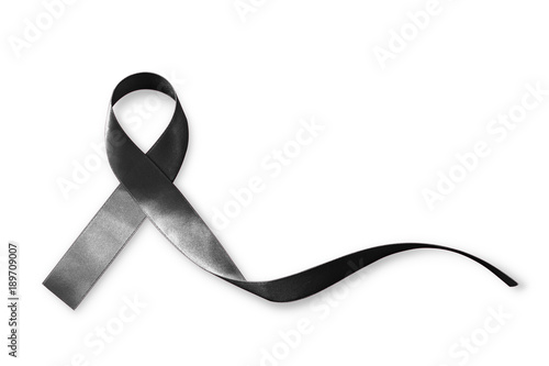 Black Ribbon symbol raising public awareness on Melanoma and skin cancer prevention and mourning for the death loss (bow isolated with clipping path on white background) photo