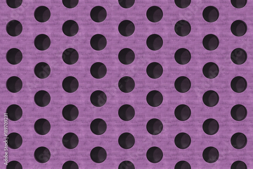 Plain violet wooden surface with cylindrical holes