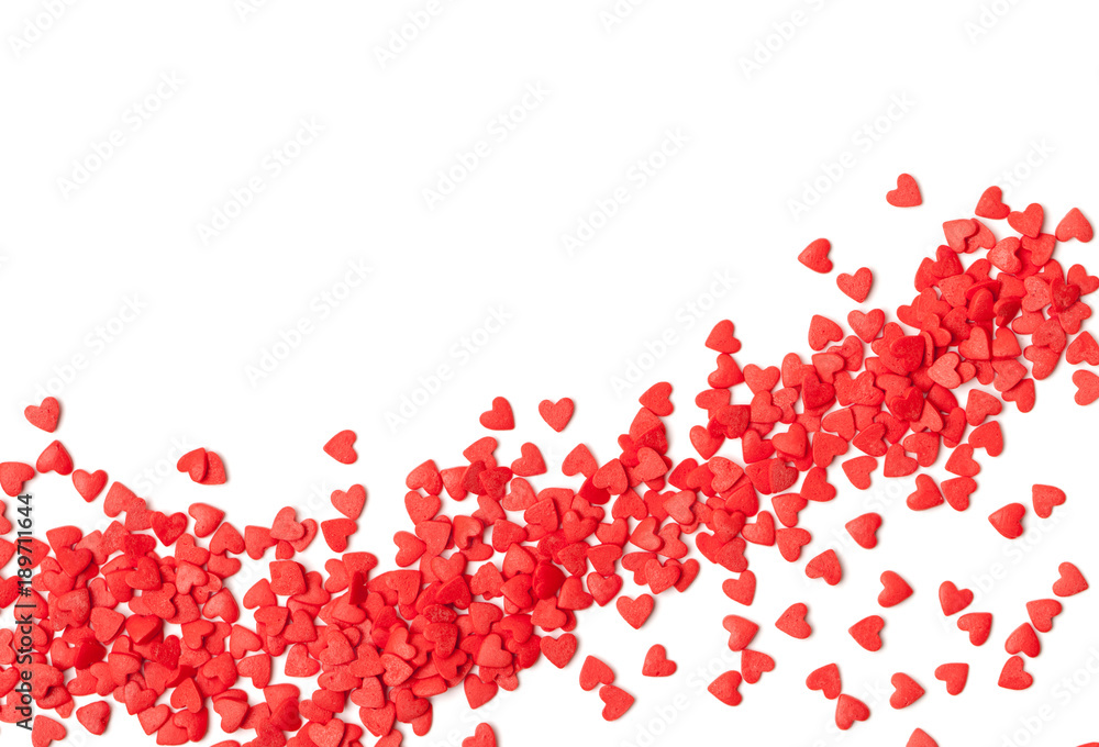 A scattering of sweet red hearts on a white background