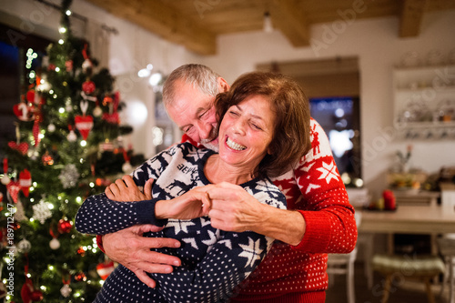 Senior couple having fun at Christmas time.