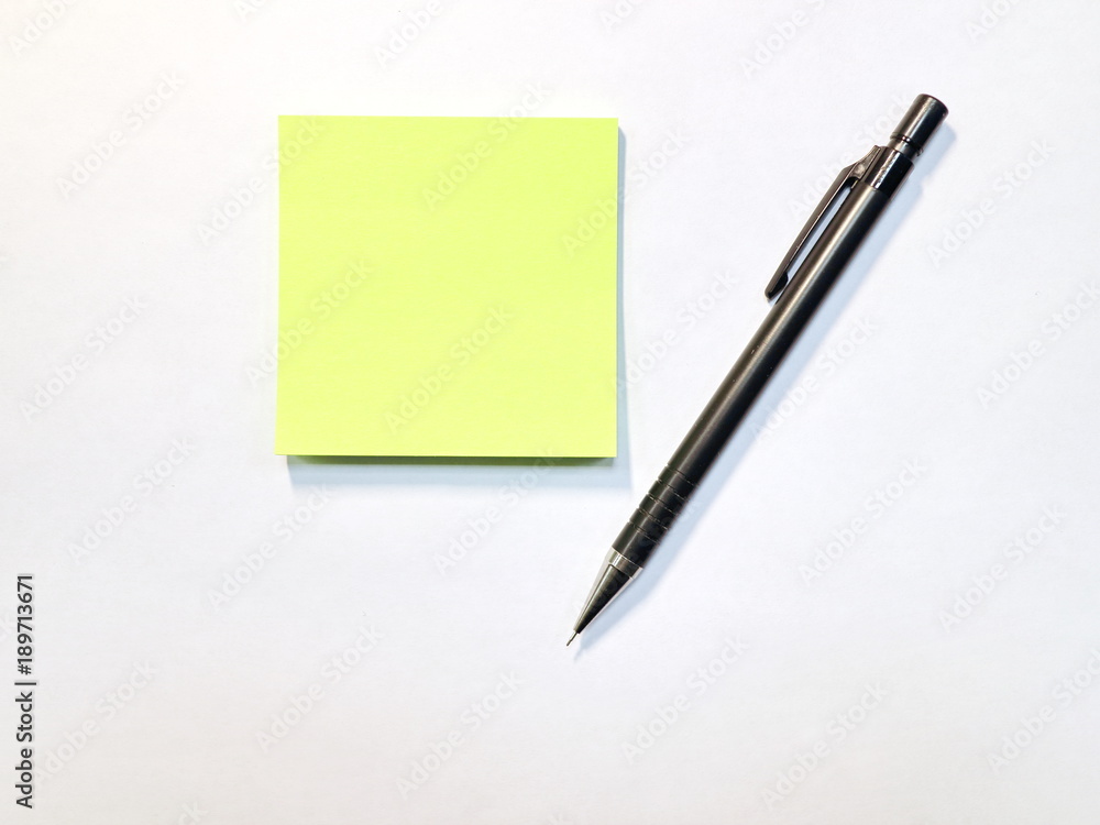 auto pencil eraser and yellow sticker on white background auto pencil eraser and yellow sticker on white background