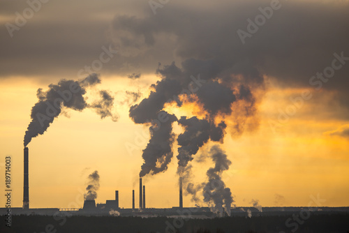 Smoke from the pipes in the factory © schankz