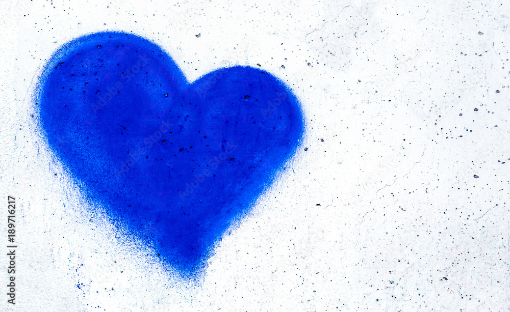 Blue heart on concrete wall