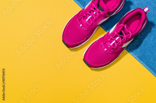 Fitness accessories, healthy and active lifestyles concept background with copy space for text. Products with vibrant, punchy pastel colours and frame composition. Image taken from above, top view. © wstockstudio