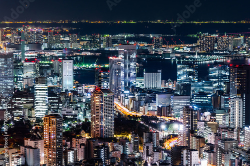Asia Business concept for real estate & corporate construction - panoramic modern city skyline view of Tokyo Metropolitan Expressway junction with colorful neon night in Roppongi Hill, Tokyo, Japan