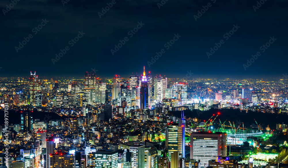 Asia Business concept for real estate & corporate construction - panoramic modern city skyline view of Shinjuku district with neon night in Roppongi Hill, Tokyo, Japan