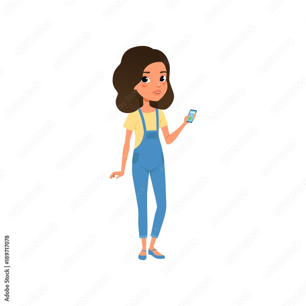 Cute teenager character dressed in yellow t-shirt and blue denim overall. Cartoon girl with smartphone in hand. Stylish casual outfit. Colorful flat vector design