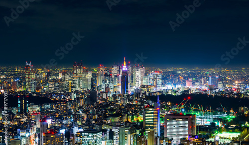 Asia Business concept for real estate   corporate construction - panoramic modern city skyline view of Shinjuku district with neon night in Roppongi Hill  Tokyo  Japan