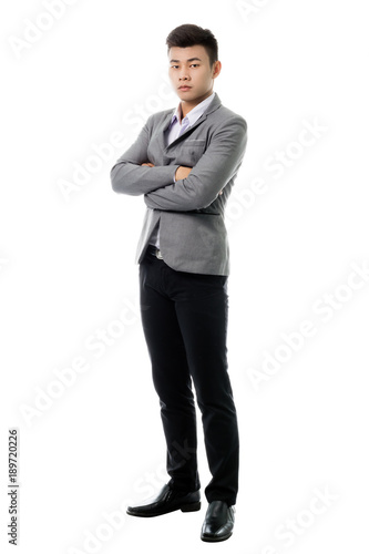 Portrait of a young business man. Isolated full length on white background