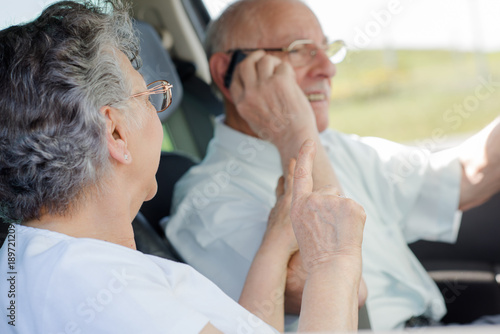 elderly couple in the car