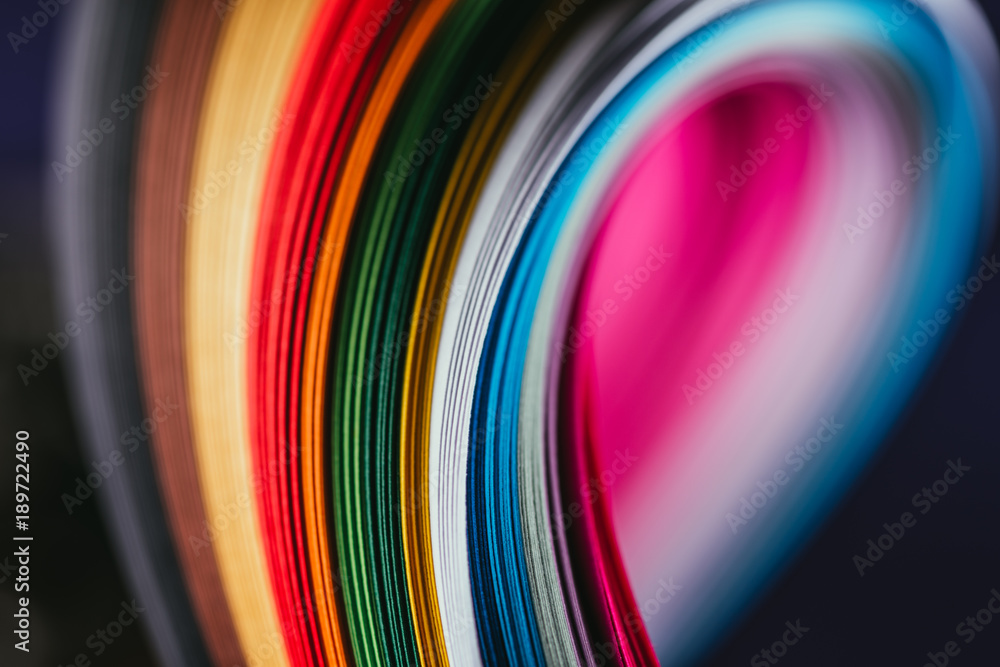 close up of colored bright quilling paper curves on black - obrazy, fototapety, plakaty 